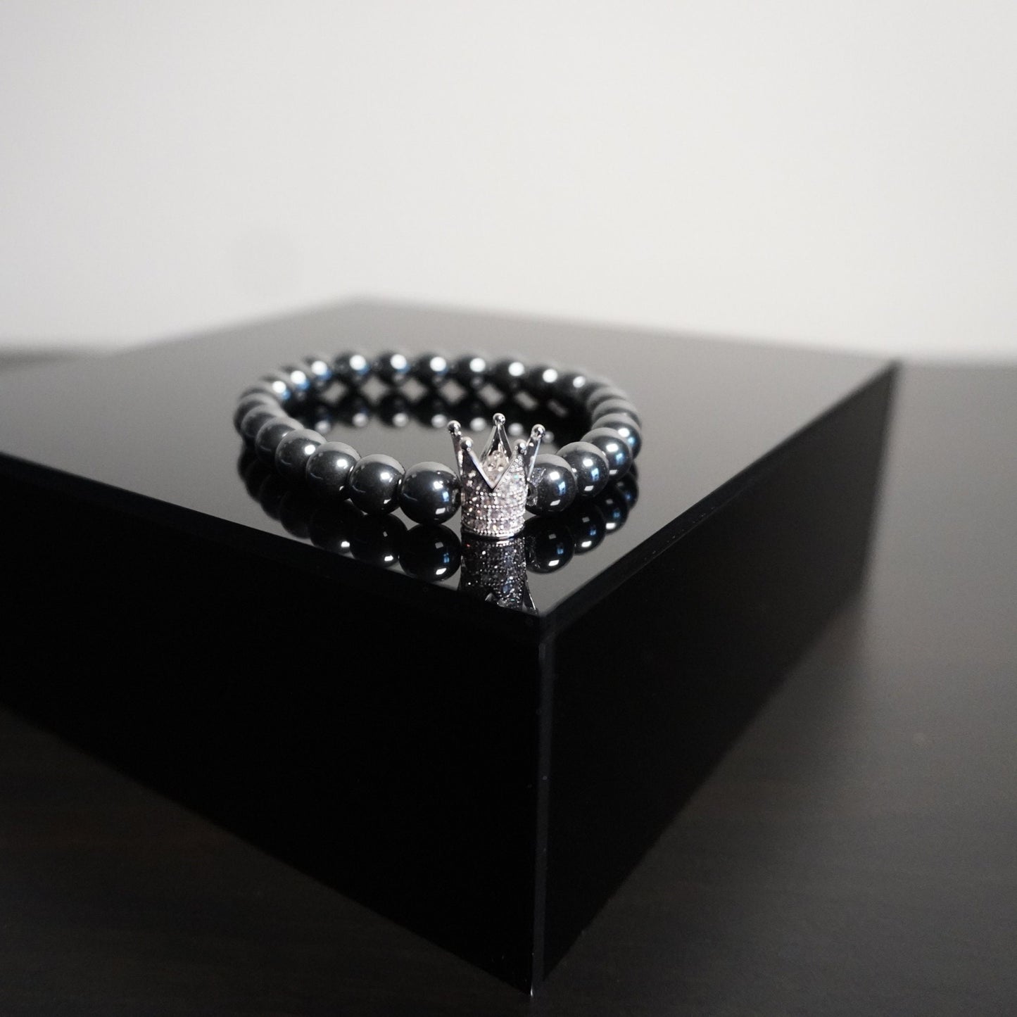 Regal Crown Hematite Bracelet - Elegant Gemstone Beaded Bracelet with Charm Accents for Sophisticated Style