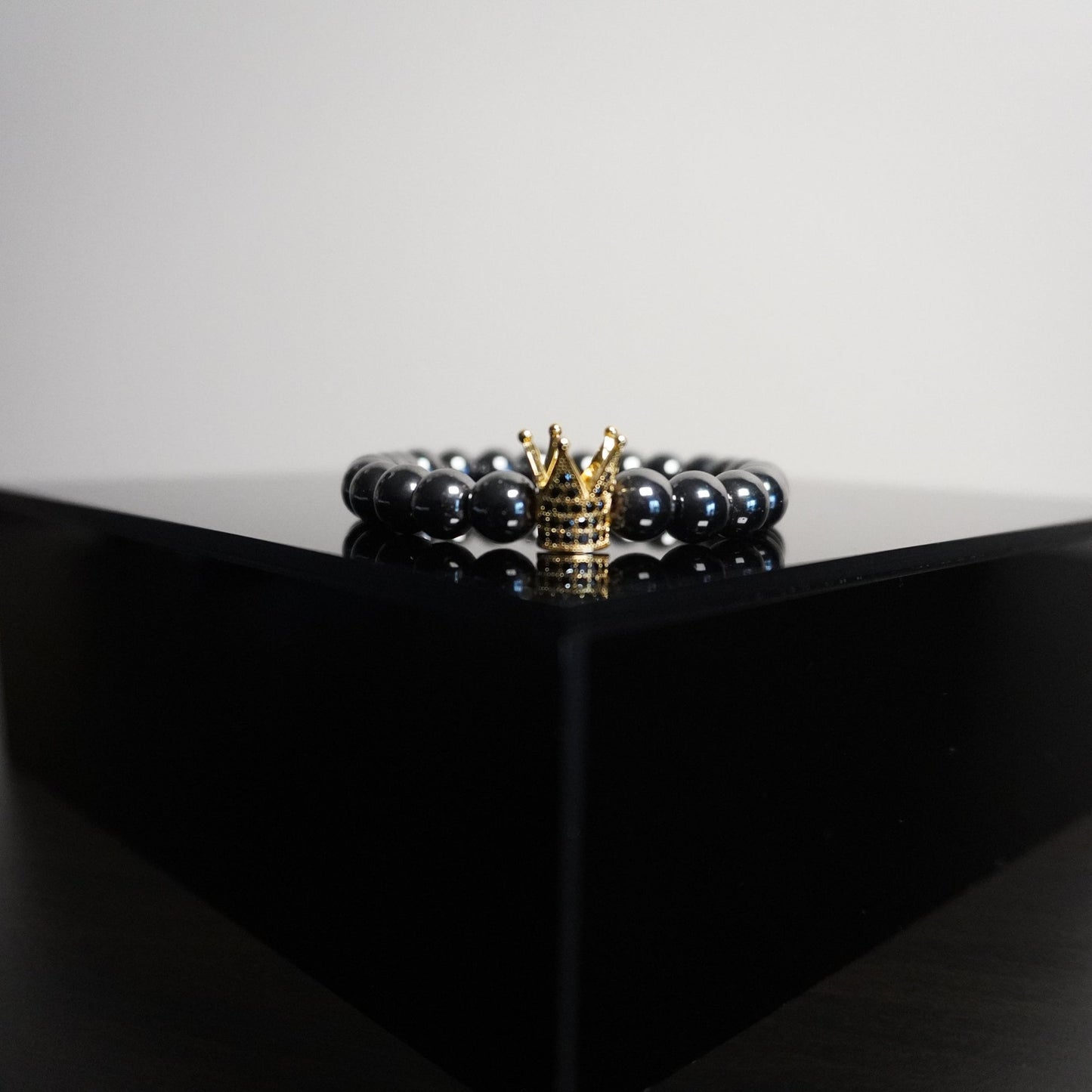 Regal Crown Hematite Bracelet - Elegant Gemstone Beaded Bracelet with Charm Accents for Sophisticated Style