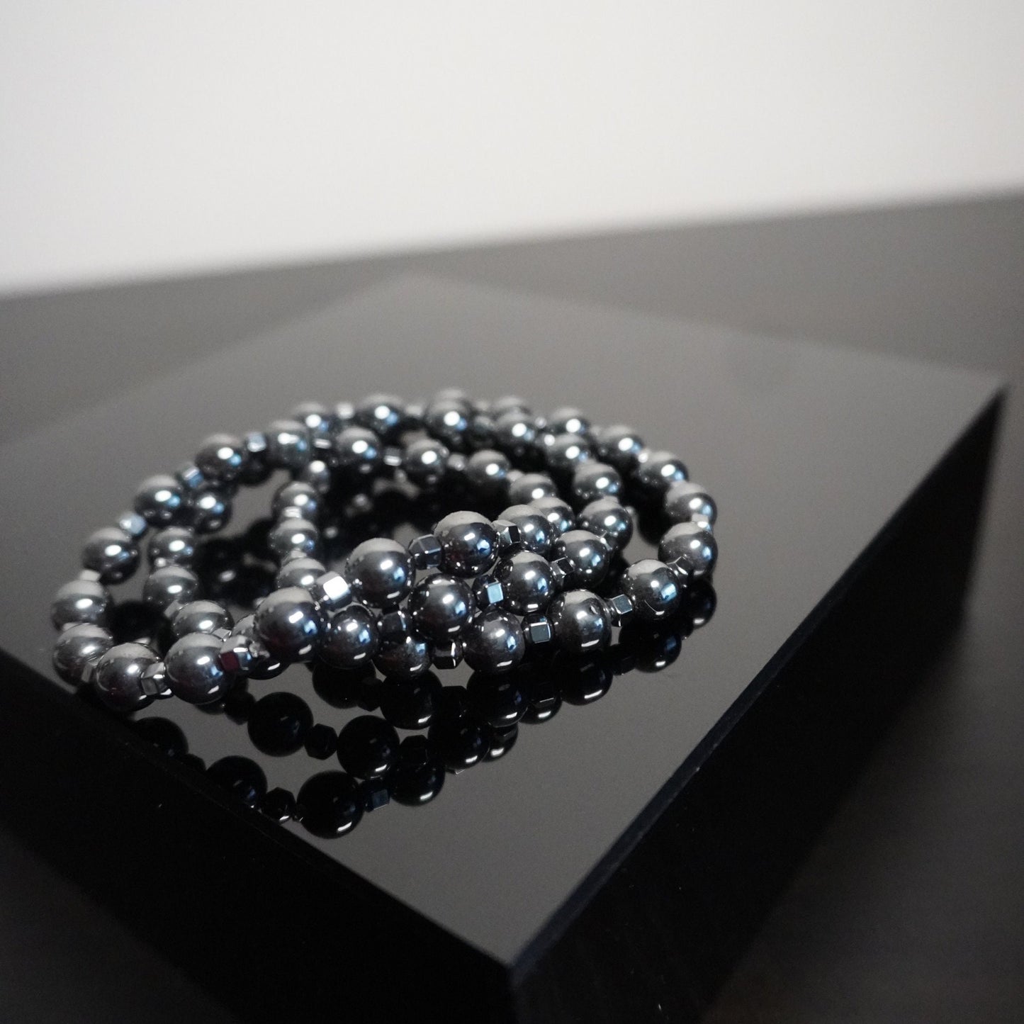 Hematite Beaded Bracelet with Cone Accents: Elegant Unisex Jewelry