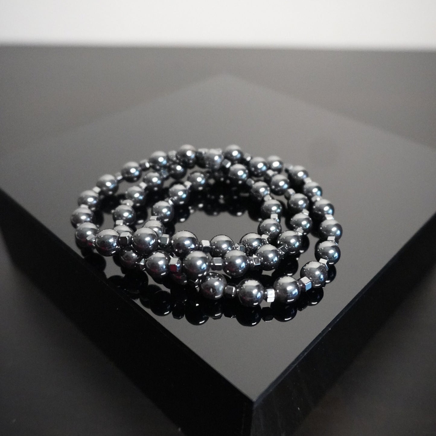 Hematite Beaded Bracelet with Cone Accents: Elegant Unisex Jewelry